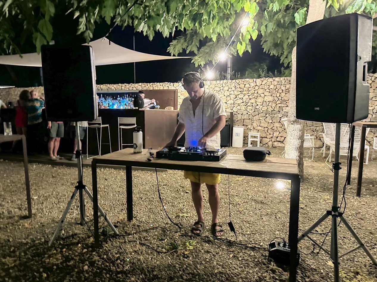 Paul DJing the welcome dinner